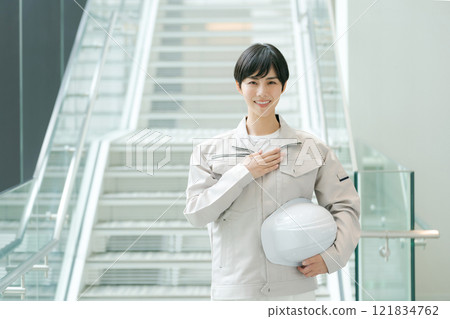 A young woman in work clothes A young woman in work clothes 121834762