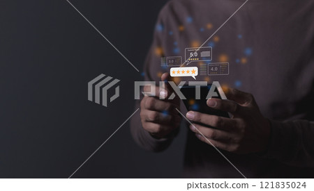Young Man hand holding Smart Phone with five star to review and give 5 stars  121835024