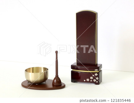 A modern-style bell and a modern-style memorial tablet displayed next to it Image 1 of a memorial service at home 121835446