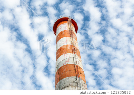 An image of a chimney that has cracked due to aging and has repair marks 121835952