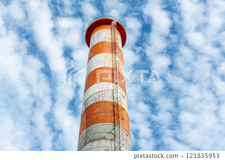 An image of a chimney that has cracked due to aging and has repair marks 121835953