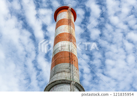 An image of a chimney that has cracked due to aging and has repair marks 121835954