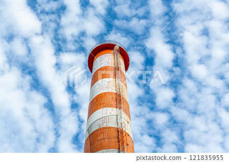 An image of a chimney that has cracked due to aging and has repair marks 121835955
