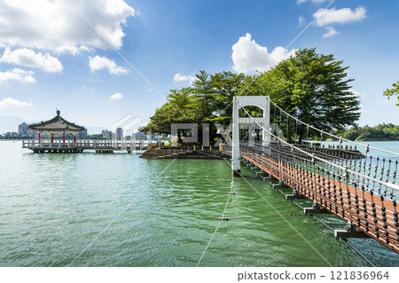 View of the suspension bridge leading to Fu Guo Island at Chenghcing Lake Scenic Area in Kaohsiung, Taiwan. 121836964