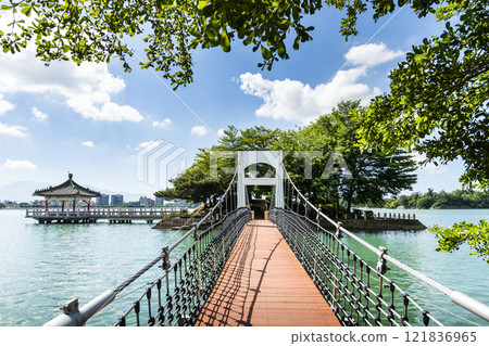 View of the suspension bridge leading to Fu Guo Island at Chenghcing Lake Scenic Area in Kaohsiung, Taiwan. View of the suspension bridge leading to Fu Guo Island at Chenghcing Lake Scenic Area in Kaohsiung, Taiwan. 121836965