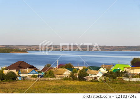 Settlement on the shore of the lake Settlement on the shore of the lake 121837242