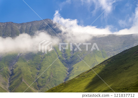 Peaks above the clouds Peaks above the clouds 121837712