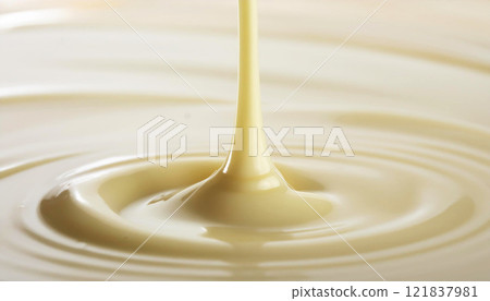Background of white chocolate pouring from above 121837981