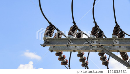 porcelain insulator on High voltage post, High voltage tower, show with high voltage construction and power lines. porcelain insulator on High voltage post, High voltage tower, show with high voltage construction and power lines. 121838581