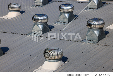 Roof Ventilator, Ball spinning ventilation, Air ventilator on the roof, Ventilators on the roof top spinning and take cool air into the building. 121838589