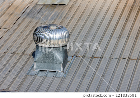 Roof Ventilator, Ball spinning ventilation, Air ventilator on the roof, Ventilators on the roof top spinning and take cool air into the building. Roof Ventilator, Ball spinning ventilation, Air ventilator on the roof, Ventilators on the roof top spinning and take cool air into the building. 121838591