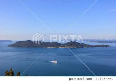 An international ferry sailing off the coast of Megijima in the Seto Inland Sea, Bisan Seto 121838669