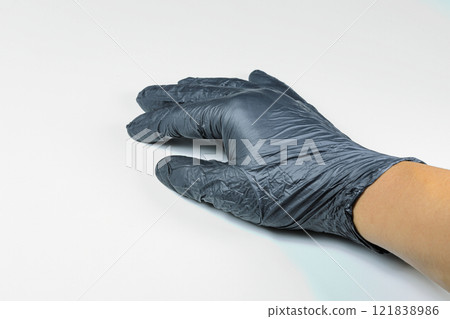 hands in black nitrile protective gloves isolated on white background. hands in black nitrile protective gloves isolated on white background. 121838986