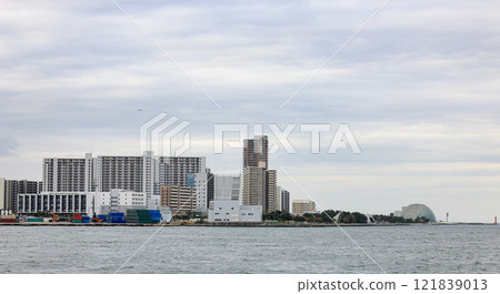Skyline of Container port at Osaka Japan, Industrial port for cargo container ship. Cargo transportation and activity at modern shipping container terminal. Skyline of Container port at Osaka Japan, Industrial port for cargo container ship. Cargo transportation and activity at modern shipping container terminal. 121839013