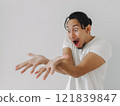 Funny wow face man looking at the empty product in his hand. 121839847