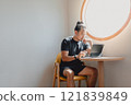 Freelance man work online on computer tablet at corner of cafe. 121839849