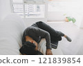 Freelance digital nomad man workonline at home but feel sleepy. 121839854