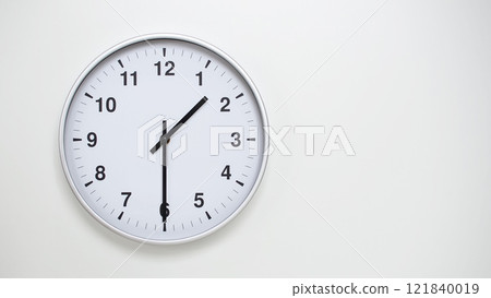 Minimalist White Clock with Silver Frame Striking 13.30/01.30 on White Background. Perfect for Time Management and Corporate Campaigns Minimalist White Clock with Silver Frame Striking 13.30/01.30 on White Background. Perfect for Time Management and Corporate Campaigns 121840019