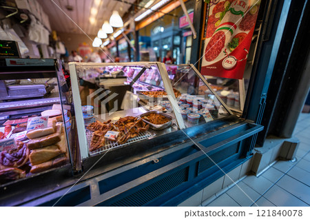 Budapest, Hungary. August 29,2022. The covered market, detail of a stall of a vendor of processed meats and cured meats. The various cuts are displayed with the tag with type and price. 121840078