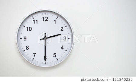 Minimalist White Clock with Silver Frame Striking 14.30/02.30 on White Background. Perfect for Time Management and Corporate Campaigns Minimalist White Clock with Silver Frame Striking 14.30/02.30 on White Background. Perfect for Time Management and Corporate Campaigns 121840223
