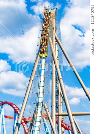 Roller Coaster in funny amusement park. Roller Coaster in funny amusement park. 121840792