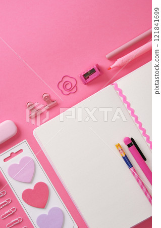 Pink stationery and an open notepad. Heart-shaped stickers. Space for your text. Pink stationery and an open notepad. Heart-shaped stickers. Space for your text. 121841699