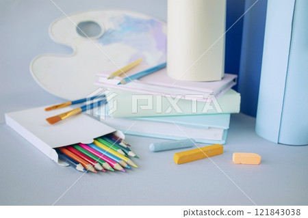 Back to school concept, stationery, paper rolls on light background, pastel colors. 121843038