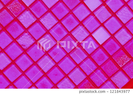 Close-up of a reflected glass facade with a rectangular grid system.  121843977