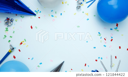 Concept of festive birthday celebrations. Birthday attributes colorful balloons, party hats, candles, confetti 121844422