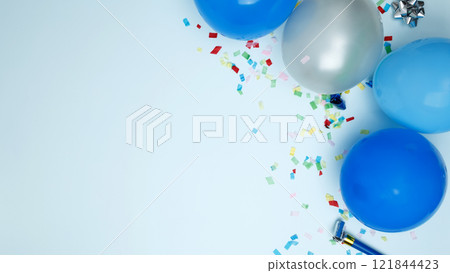 Concept of festive birthday celebrations. Birthday attributes colorful balloons, candles, confetti 121844423