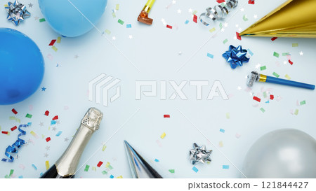 Concept of festive birthday celebrations. Birthday attributes colorful balloons, party hats, candles, confetti 121844427