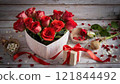 Roses and a present in a heart-shaped box Valentine's Day 121844492