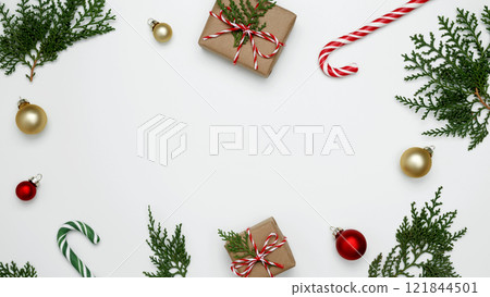 Natural holiday scene, wrapped Christmas gifts with green thuja branches creating a festive 121844501