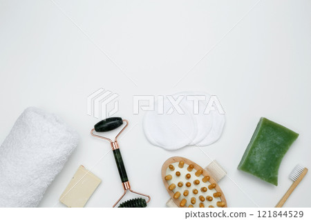 Eco-friendly beauty products: massage brush, marble roller, towel, reusable cotton pads, sustainable self-care concept Eco-friendly beauty products: massage brush, marble roller, towel, reusable cotton pads, sustainable self-care concept 121844529