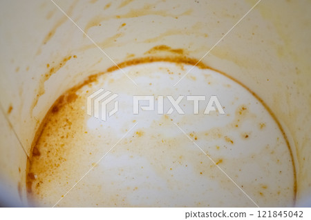 Container of cup ramen (curry flavor) after eating (stock photo) 121845042