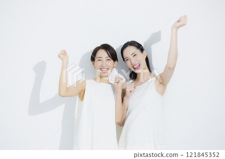 Two cuddling women 121845352