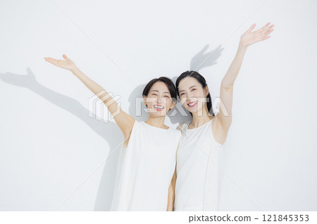 Two cuddling women 121845353