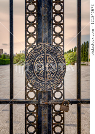 Exploring the intricate design of the side entrance gate at Taza Pir Mosque in Baku, Azerbaijan during sunset Exploring the intricate design of the side entrance gate at Taza Pir Mosque in Baku, Azerbaijan during sunset 121845678