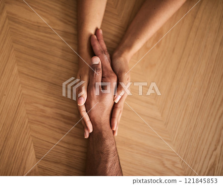 Care, kindness, support with two people holding hands while sitting and talking together. Above affectionate couple, showing trust and forgiveness while bonding and discussing their relationship 121845853