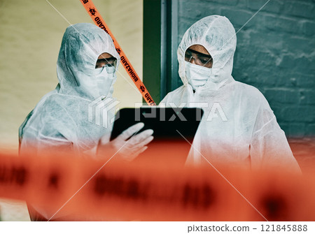 Covid, corona virus and outbreak healthcare workers inspecting contamination on site with red tape, protective mask and clipboard. Medical doctor or scientist working together during pandemic crisis 121845888