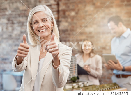 Thumbs up, sign and finger shown by a happy business woman, manager or ceo while standing in office at work. Cheerful, pleased and satisfied female showing thumbs in approval, agreement or thank you Thumbs up, sign and finger shown by a happy business woman, manager or ceo while standing in office at work. Cheerful, pleased and satisfied female showing thumbs in approval, agreement or thank you 121845895