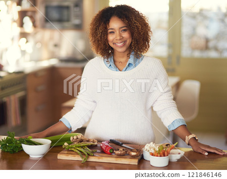 Healthy eating done right. Portrait of a happy young woman preparing a healthy meal at home. Healthy eating done right. Portrait of a happy young woman preparing a healthy meal at home. 121846146