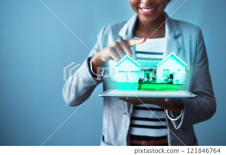 Corporate business woman holding a tablet with property cgi graphics while standing against a blue studio background alone. Happy, smiling and cheerful female designing a vr home with technology Corporate business woman holding a tablet with property cgi graphics while standing against a blue studio background alone. Happy, smiling and cheerful female designing a vr home with technology 121846764