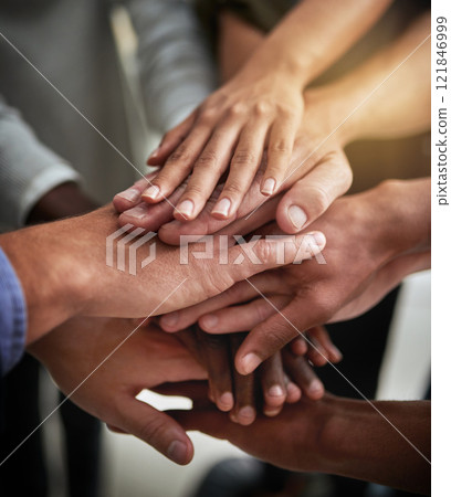 Hands of group of corporate business people in unity for motivation, success and showing teamwork. Team of workers, employees and colleagues piling hands together for support, trust and victory 121846999