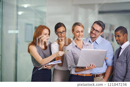 Manager with laptop showing, training or presenting strategy ideas or brainstorm plans with diverse group of office colleagues. Confident, smiling or happy leader updating team of staff on technology Manager with laptop showing, training or presenting strategy ideas or brainstorm plans with diverse group of office colleagues. Confident, smiling or happy leader updating team of staff on technology 121847236