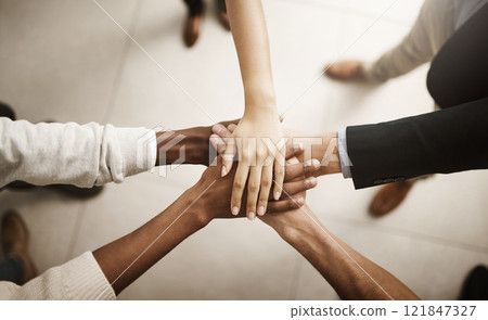Support, teamworking and joining hands together during team building session from above. Closeup of businesspeople doing stacked gesture to show collaboration in pursuit of goal or success in office Support, teamworking and joining hands together during team building session from above. Closeup of businesspeople doing stacked gesture to show collaboration in pursuit of goal or success in office 121847327