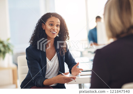 Interview with a happy, excited and confident human resources manager talking to a shortlist candidate for a job. Young business woman meeting with a colleague or coworker in her office at work Interview with a happy, excited and confident human resources manager talking to a shortlist candidate for a job. Young business woman meeting with a colleague or coworker in her office at work 121847540