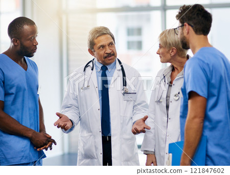 Doctors talk, brainstorm and plan together to collaborate and discuss medical procedures in a hospital. Health professional colleagues consult and working together in a meeting while sharing ideas Doctors talk, brainstorm and plan together to collaborate and discuss medical procedures in a hospital. Health professional colleagues consult and working together in a meeting while sharing ideas 121847602