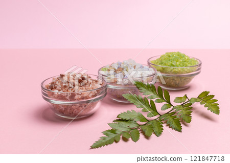 Spa sea salt on the pink background. Sea bath salt. Spa sea salt on the pink background. Sea bath salt. 121847718
