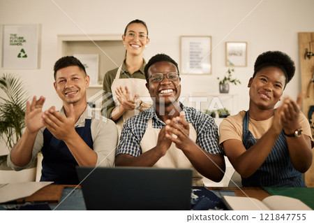 Clapping, cheering and excited fashion design team welcoming, celebrating and supporting employee promotion or new design. Diverse group of happy and smiling and tailors and seamstresses in workshop 121847755